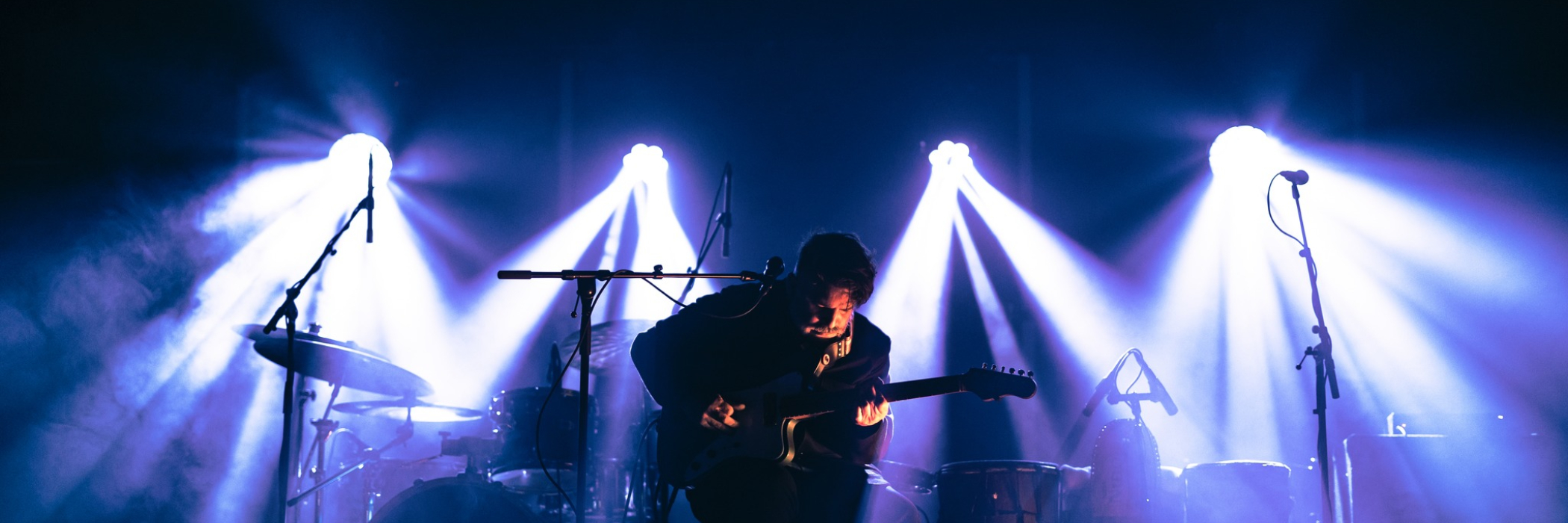 Chris Cavaliere on stage under the lights