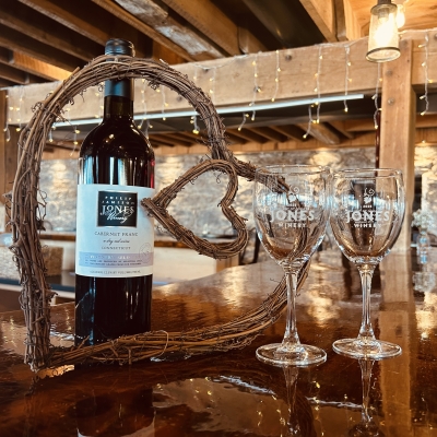 Winery Valentine's Day with wine glasses alongside a heart wreath